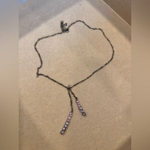 Choker necklace with purple stones.